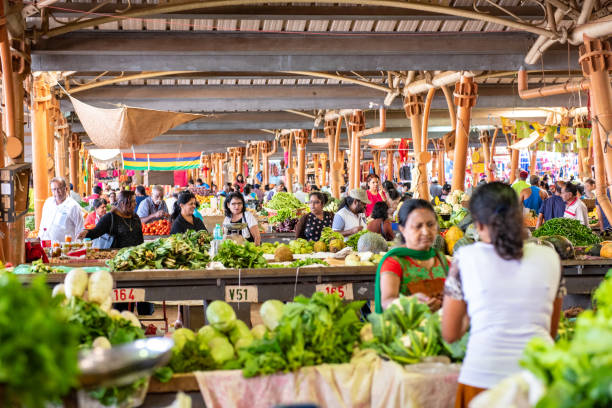 Both locals and tourists flock to the Wednesday and Sunday markets at Centre de Flacq, the main town in the east of Mauritius in the Indian Ocean. It is conveniently located directly opposite the main bus station and, like most markets throughout the world, is vibrant, crowded and noisy. The huge market is all under cover and sells locally grown produce as well as clothing, household goods and a few souvenirs. There is a small area to the rear of the market were shoppers can relax at tables with a glass of fresh coconut milk.