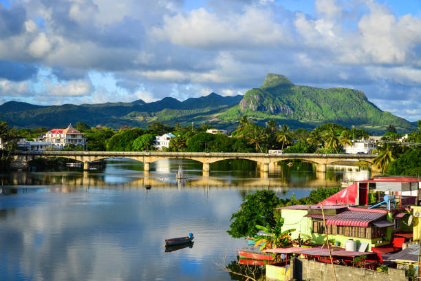 River scene with mountains in Mahebourg, Mauritius. Mauritius, an Indian Ocean island nation, is known for its beaches, lagoons and reefs.